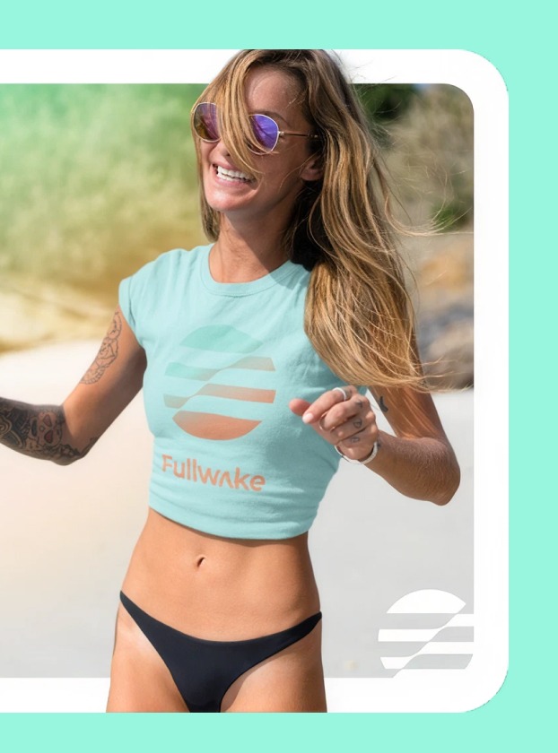 Model running on a beach wearing a mint Fullwake crop top